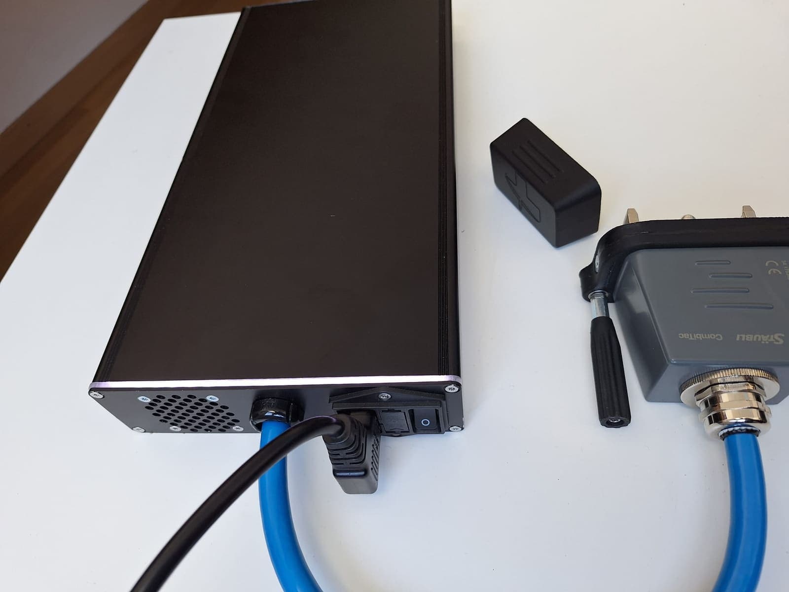 Connector side of the Compact Charger with cooling vents and switch